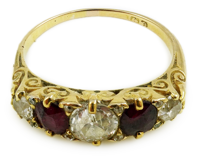 A late Victorian 18ct gold, two stone ruby and three stone diamond set half hoop ring